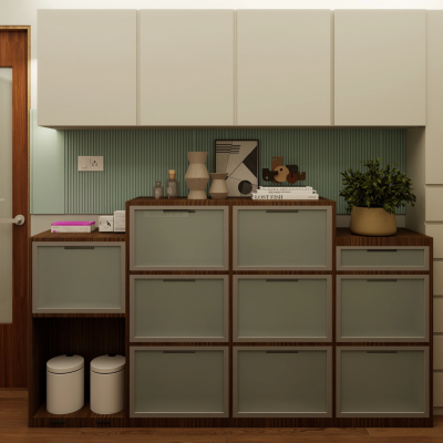 Modern storage cabinet unit with frosted glass drawers, white upper overhead cabinets, and a light green fluted backsplash panel.